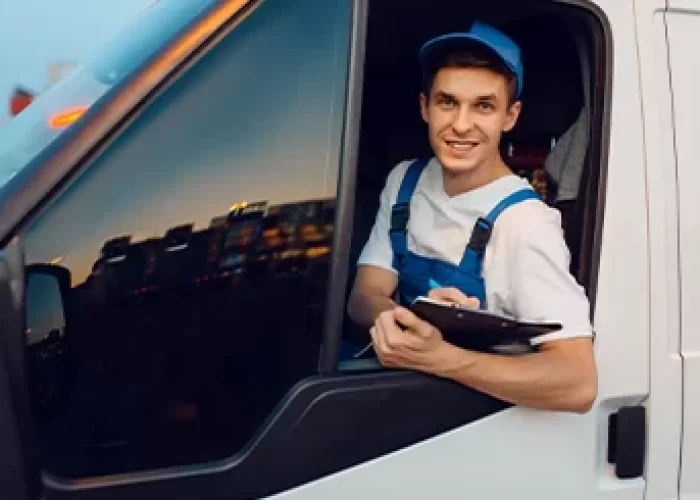 a man in a blue hat holding a clipboard